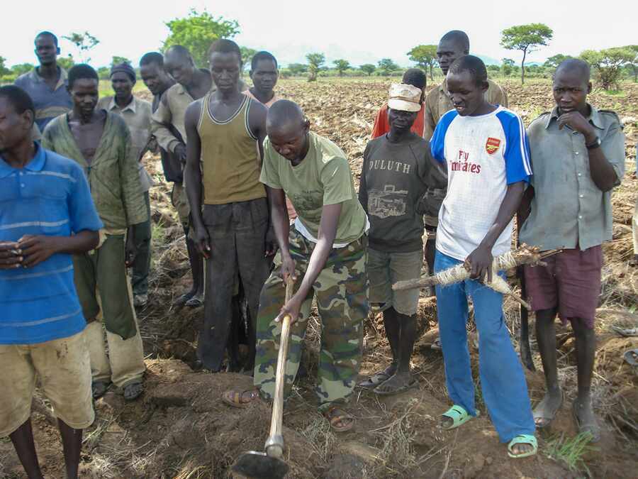 Community members participating in practical rehabilitation work.