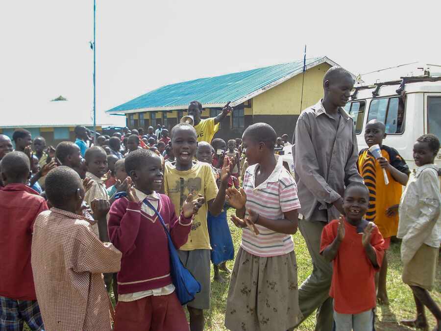 Civil and security representatives discussing community conditions in the field.