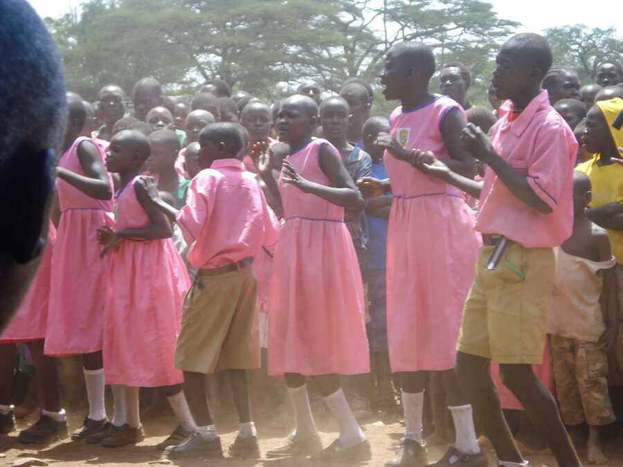 A community gathering during programme outreach.