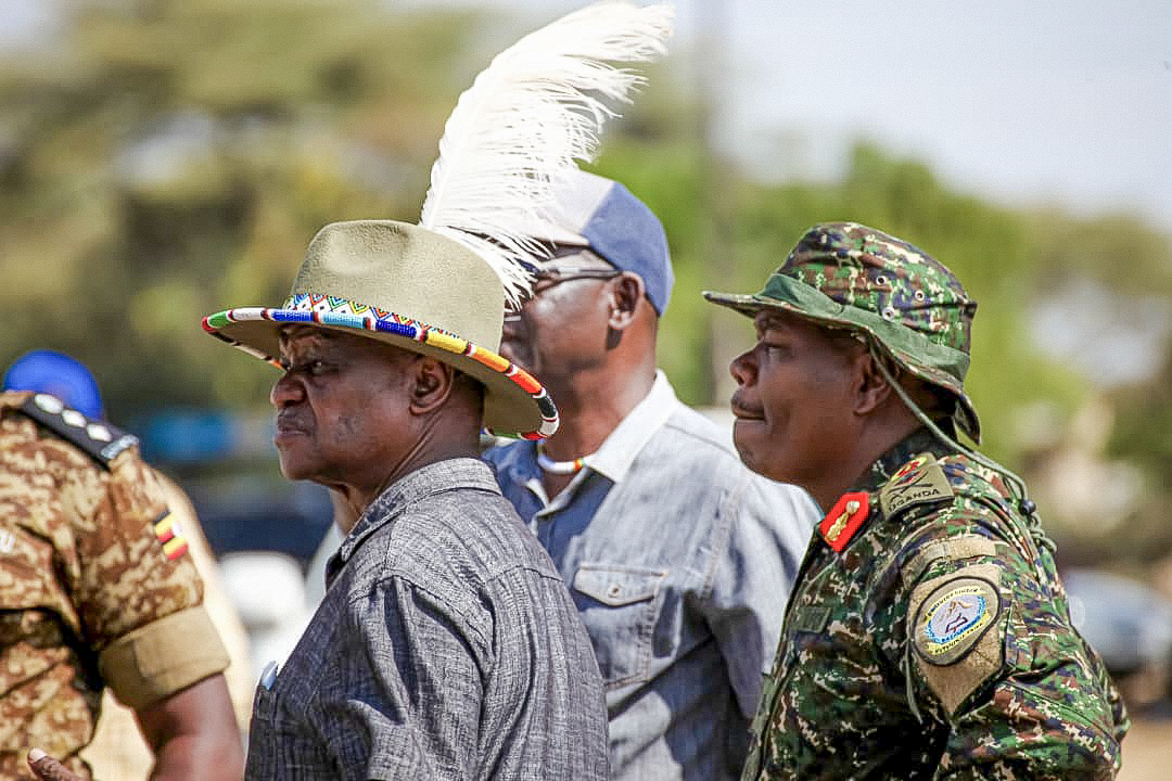 Hon. David Bwangamoe Pulkol with security and regional leaders during field engagement in Moroto