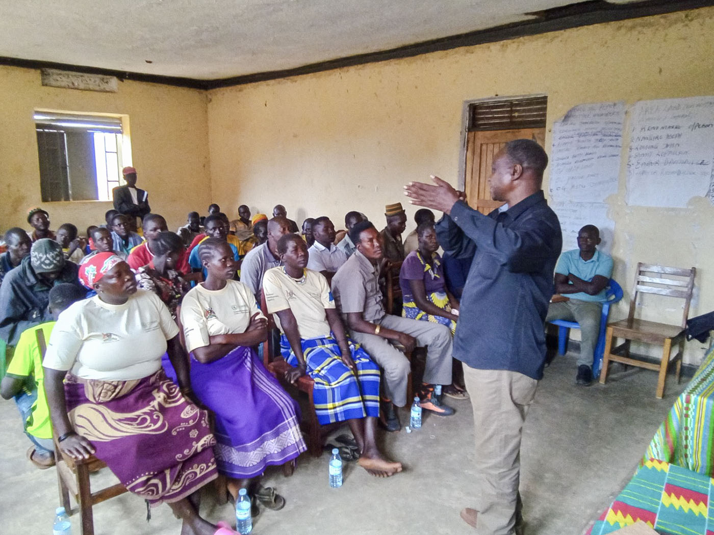 A facilitator leading a PACED community dialogue in Moroto District